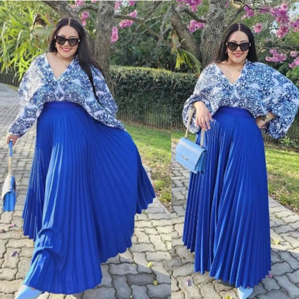 Blue printed top with V-neck and long sleeves paired with pleated maxi skirt