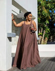 Brown sleeveless maxi dress with gathered skirt and scoop neckline