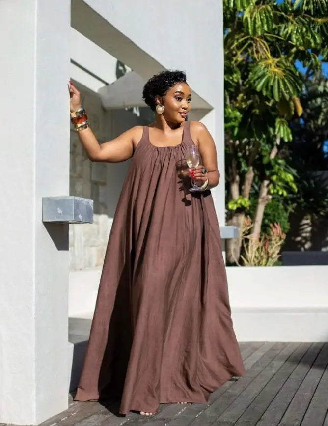 Brown sleeveless maxi dress with gathered skirt and scoop neckline