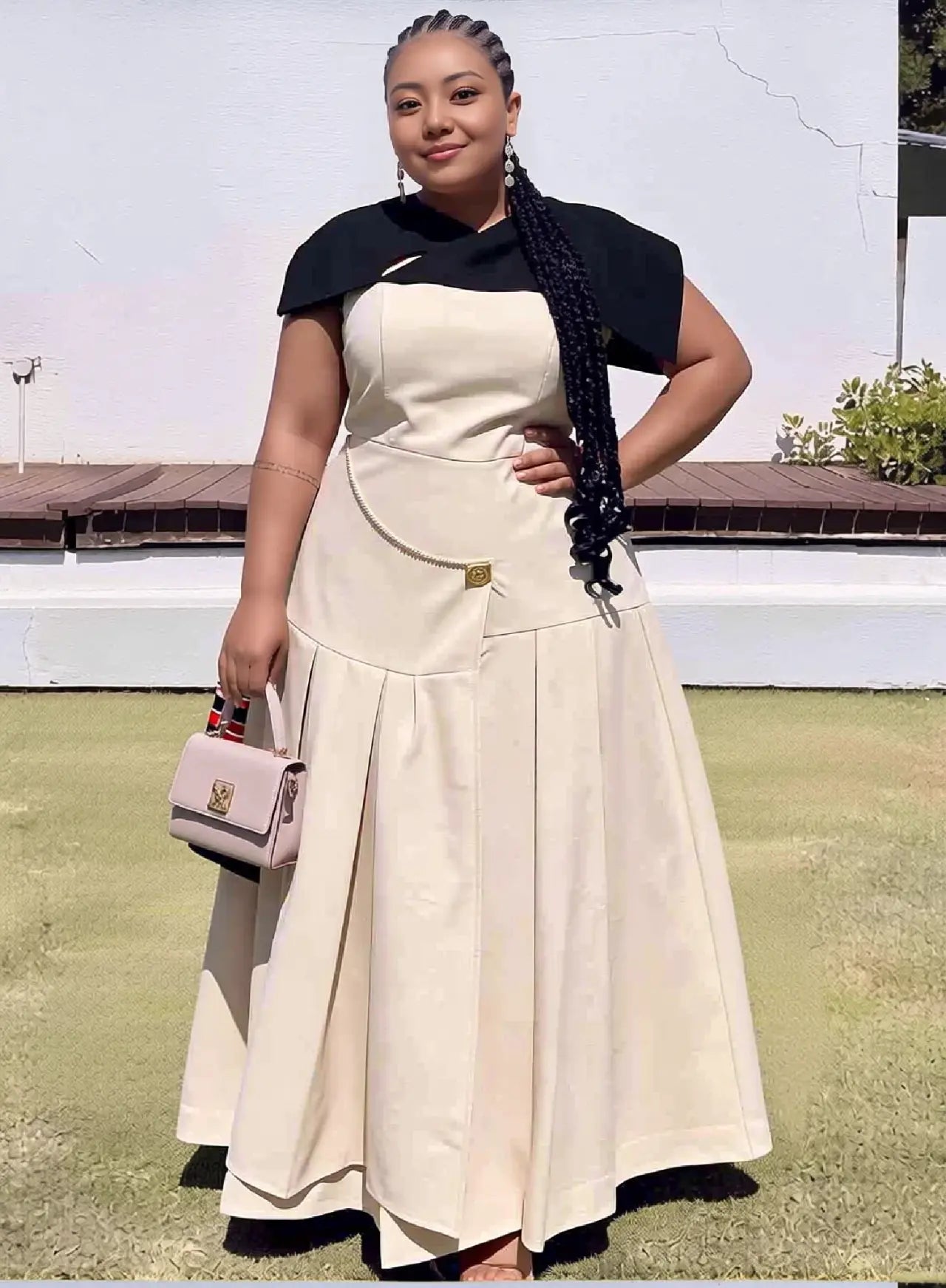 Cream maxi A-line dress with pleated skirt and dark capelet