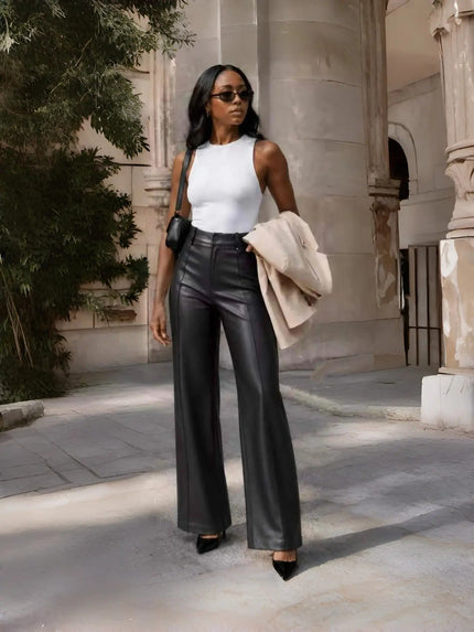 Black high-waist tailored wide-leg pants with crease seams and belt loops