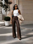 Brown high-waist tailored wide-leg pants with crease seams and belt loops