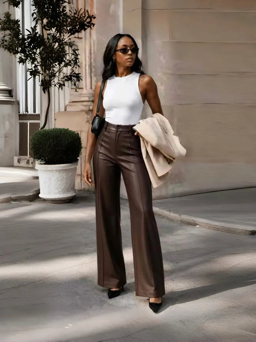 Brown high-waist tailored wide-leg pants with crease seams and belt loops