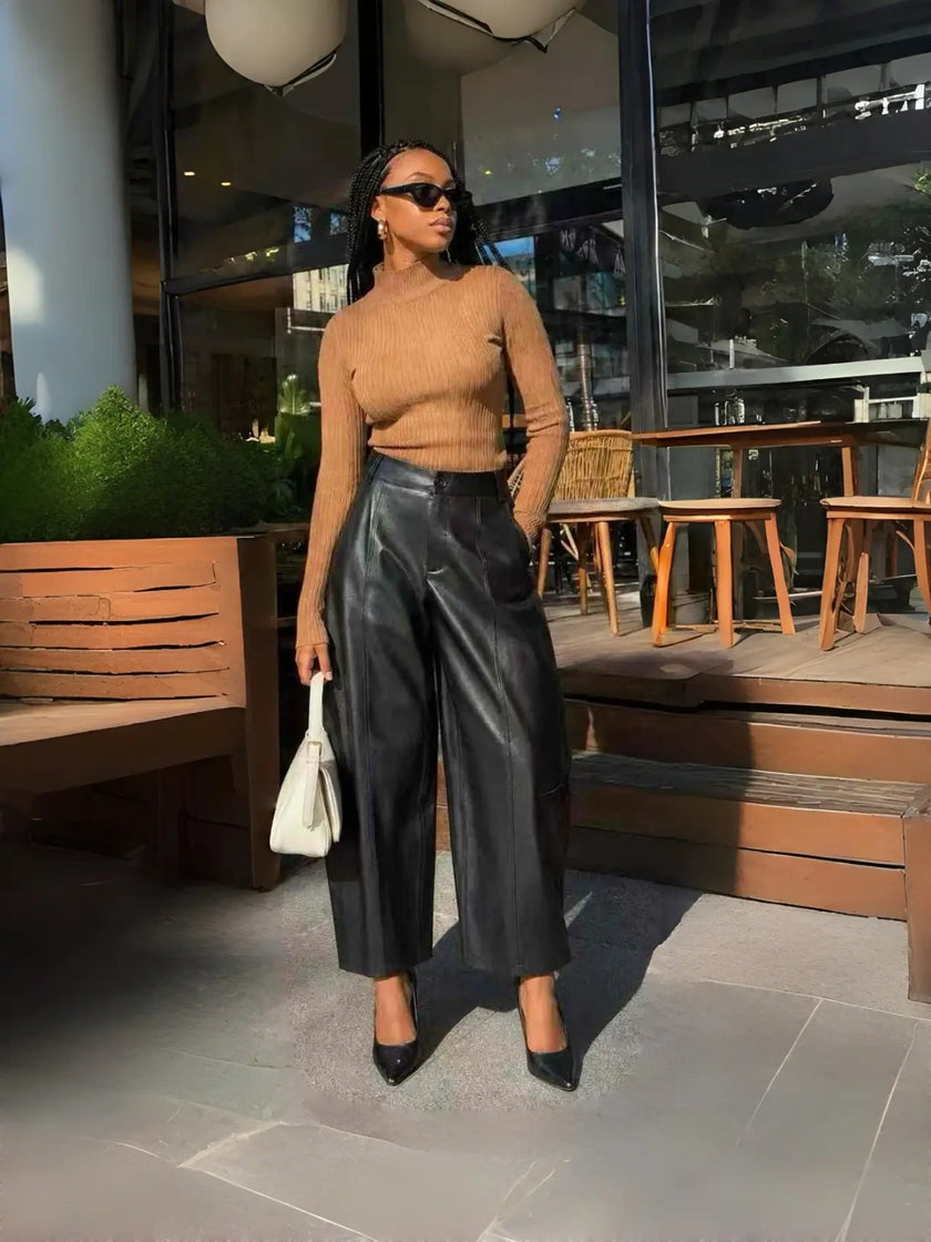 High-waist black leather wide-leg pants with front seam