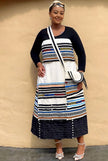 Geometric maxi skirt set with long sleeves, cream panel, black skirt and bead trim