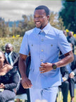 Light blue short-sleeve two-piece suit with button front and chest pockets