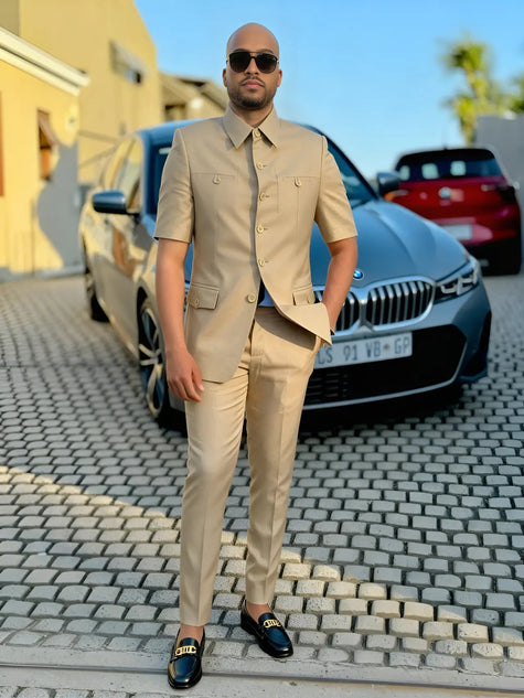 Men's beige short-sleeve button-front two-piece suit with chest pockets and matching pants