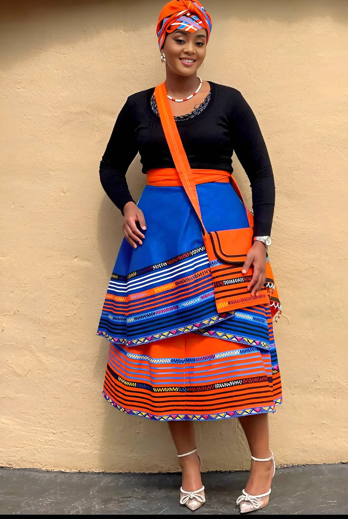 Layered geometric stripe skirt in blue and orange with wide tiered hem.