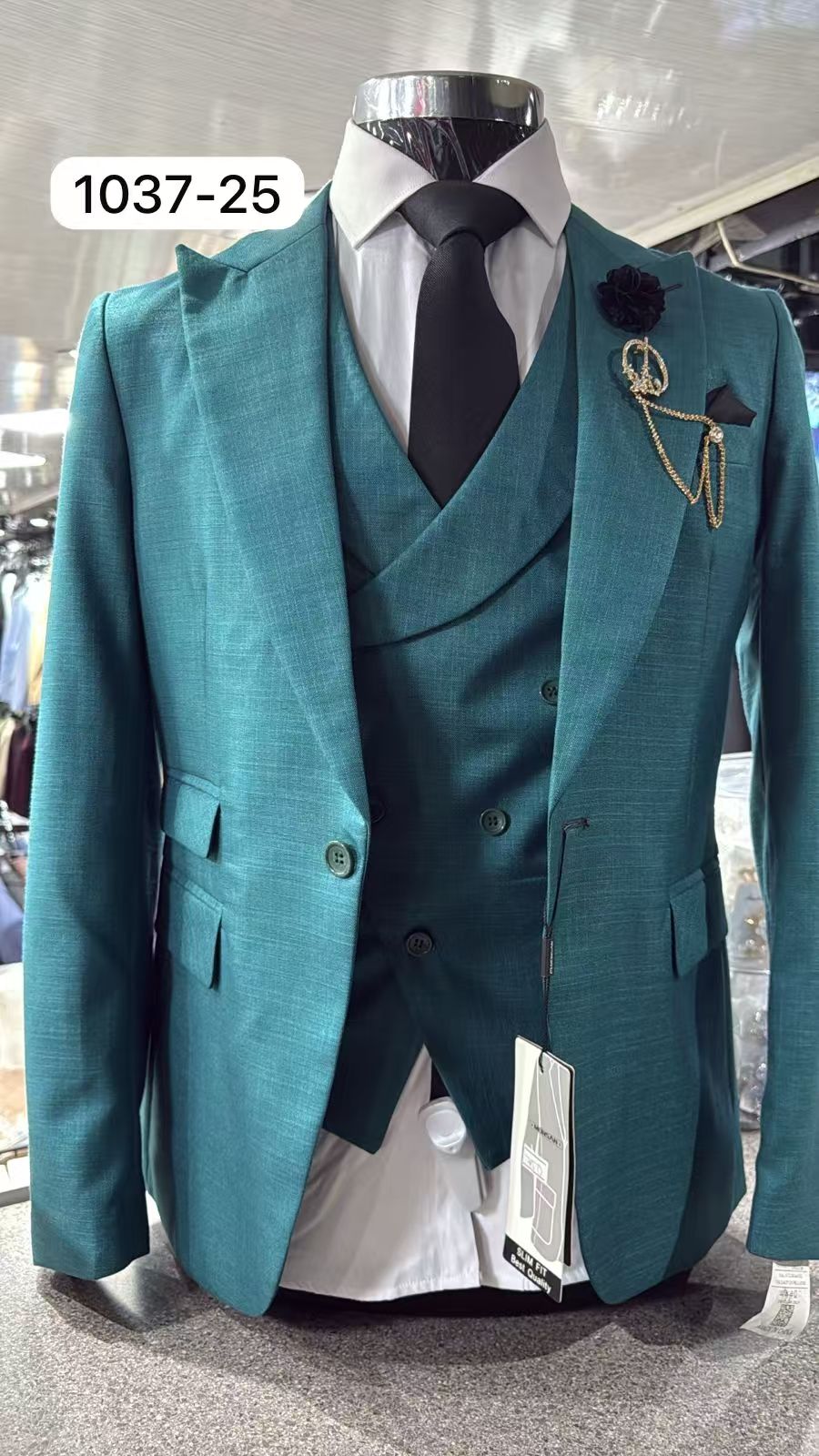 Teal slim fit 3-piece suit with peak lapel, matching vest and jacket