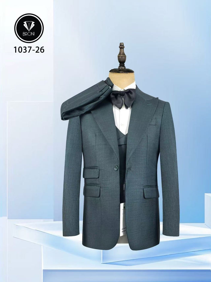 Dark teal slim fit suit jacket with peak lapels and matching vest