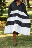 Collared striped midi dress with long sleeves, black and white horizontal bands, flared skirt