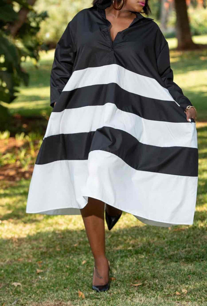 Collared striped midi dress with long sleeves, black and white horizontal bands, flared skirt