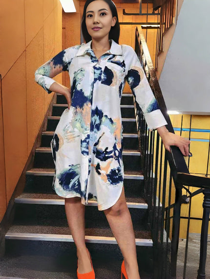 Abstract shirt dress with white and blue paint-style print, long sleeves, button front.