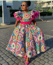 Heritage midi dress with puff sleeves and ruffle style, colorful circular print.