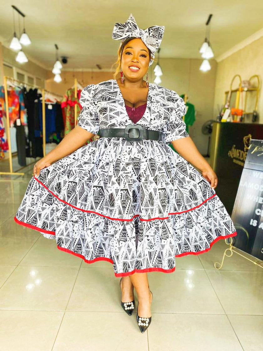 Short-Sleeved Traditional Dress with Geometric Design and Red Hemline Trim