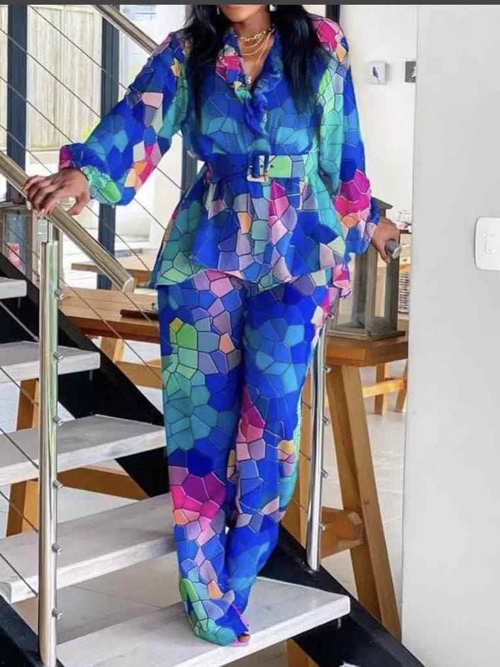 Women’s matching blouse and trousers set with vibrant multicolor geometric print, long sleeves