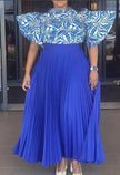 Blue pleated maxi skirt with patterned puff-sleeve top, gathered waist
