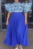 Blue pleated maxi skirt with patterned puff-sleeve top, gathered waist