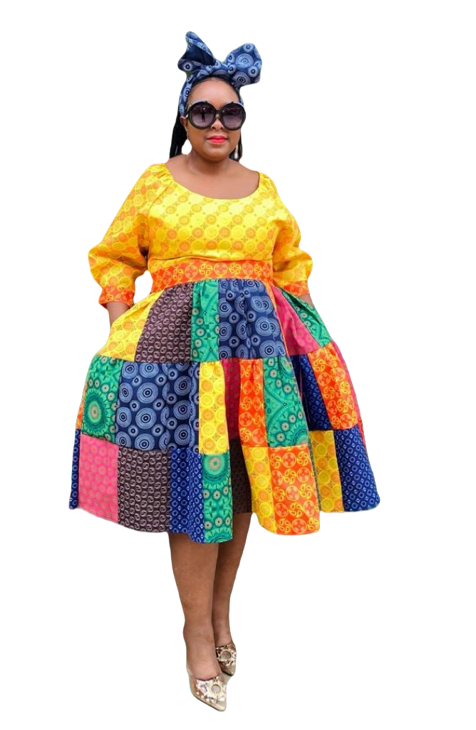 Patchwork midi dress with long sleeves, round neckline, multicolor patterned panels