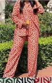 Geometric printed shirt and trouser set, red-and-white pattern with button front
