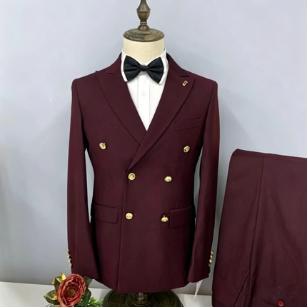 Burgundy double-breasted peak lapel suit jacket with gold buttons and black bow tie