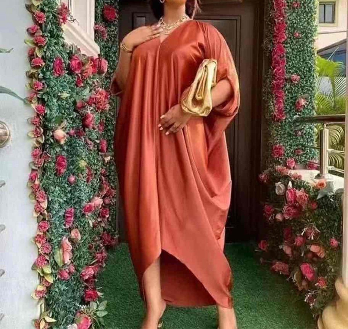 Asymmetrical kaftan dress in rust orange, one-shoulder V-neck with draped fabric