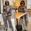 Printed flare bell trousers with wide-leg pattern in blue, green and yellow, full length