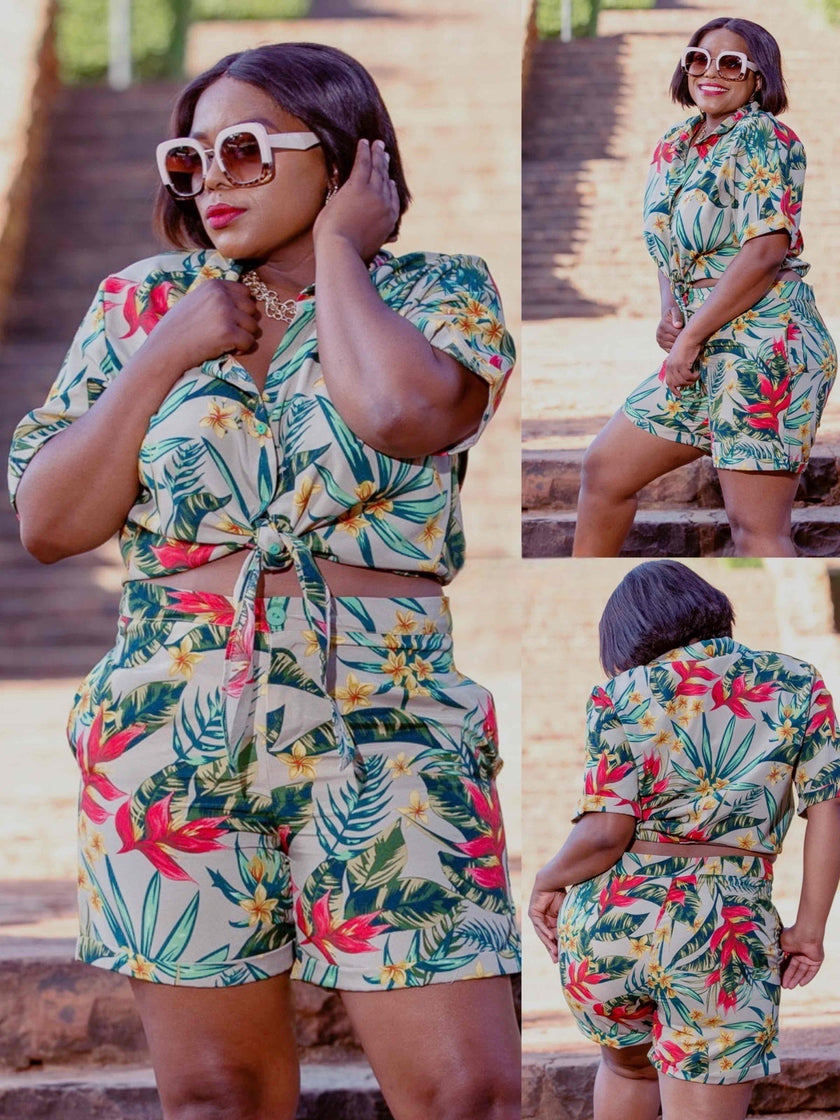 Tropical floral print two-piece set featuring a short-sleeve tie-front shirt and high-waisted shorts