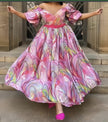 Pink maxi dress with puff sleeves, multicolor abstract print, cinched waist
