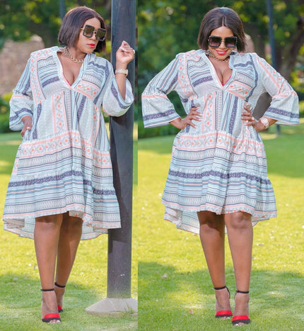 Flared-sleeve midi dress with V-neck, light blue and coral geometric stripe print.