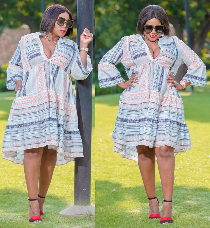 Flared-sleeve midi dress with V-neck, light blue and coral geometric stripe print.