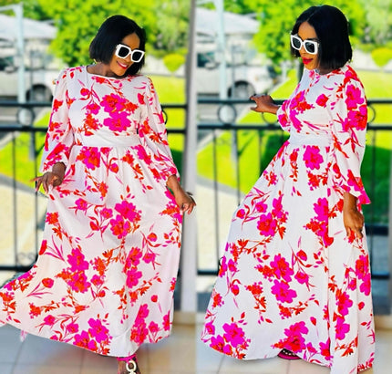 Floral maxi dress with puff sleeves, light background and pink red blooms