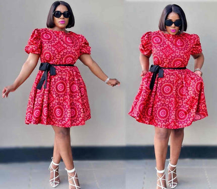 Red floral mini dress with puff sleeves, black waist belt, and flared skirt