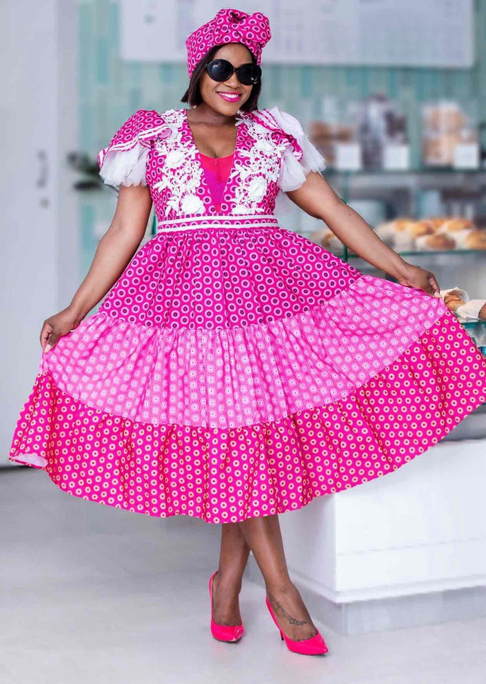 Traditional Puff-Sleeve Dress with Circular Patterns and Lace Trim