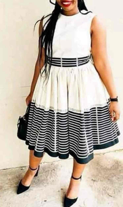 Sleeveless striped flared dress with high neck and contrast waist band