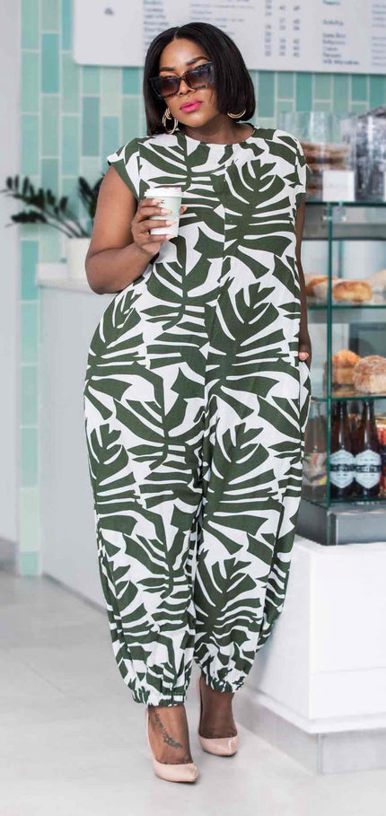 Leaf-print jumpsuit, short sleeves, round neck, tapered legs; green and white.