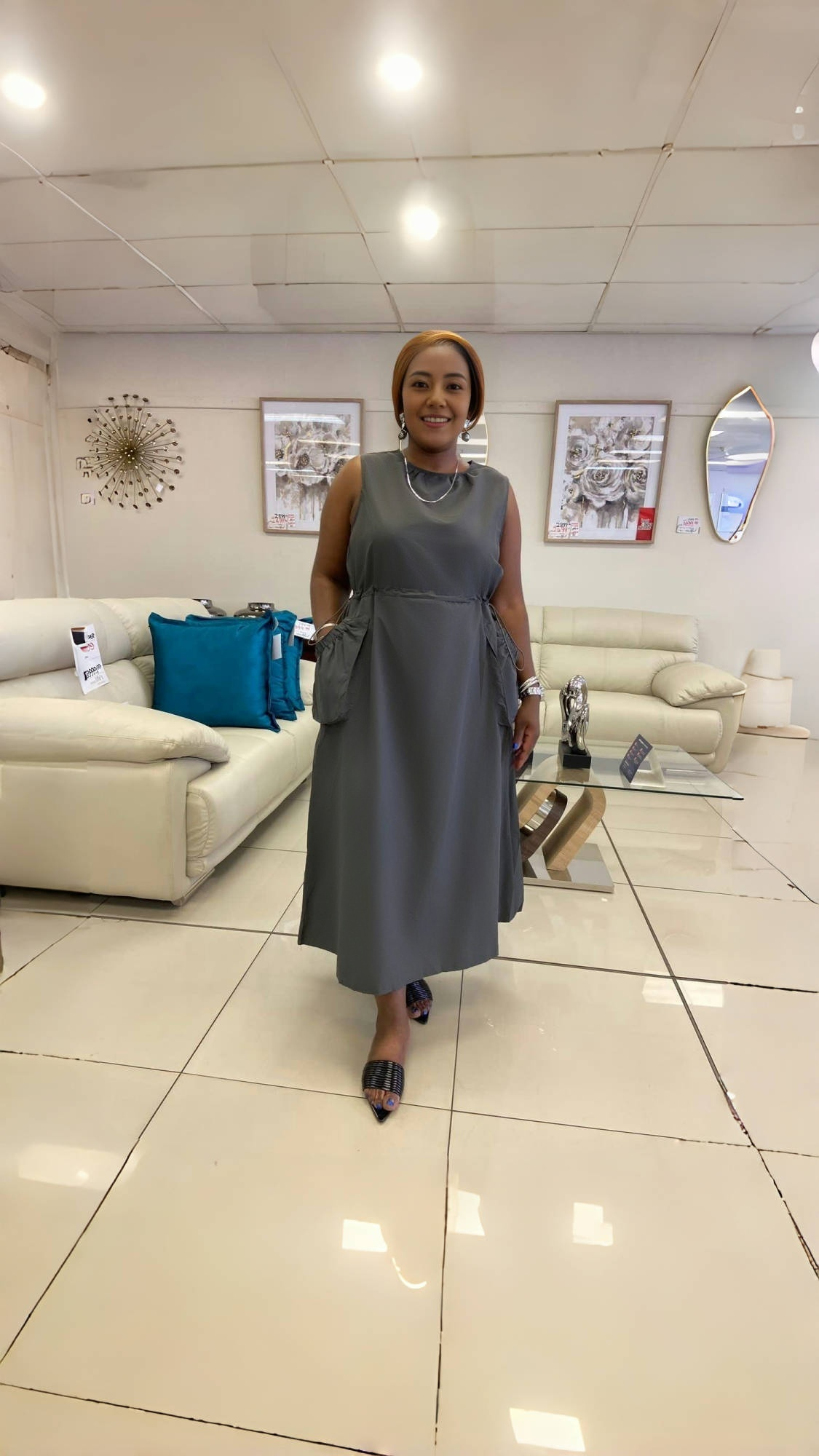 Grey sleeveless midi pocket dress with pleated, gathered skirt