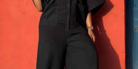Black two-piece utility jumpsuit set with button-front and wide legs