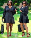 Dark V-neck skater dress with long flared sleeves, gathered waist, skater skirt.