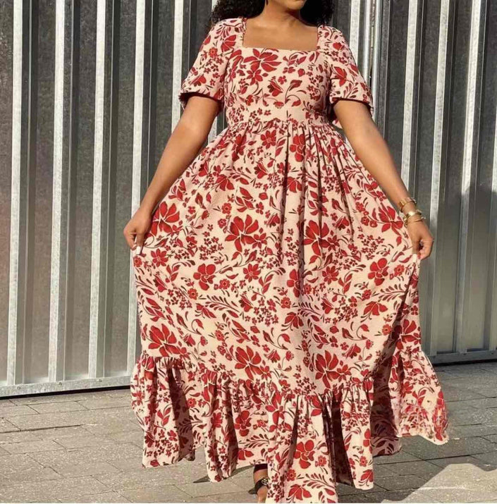 Floral maxi dress in cream with red gathered short sleeves and tiered ruffle hem