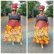 Maxi African print skirt with red, yellow and daisy flowers, gathered waist and full flare