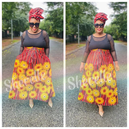 Maxi African print skirt with red, yellow and daisy flowers, gathered waist and full flare