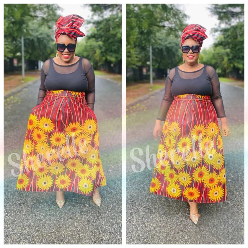 Maxi African print skirt with red, yellow and daisy flowers, gathered waist and full flare