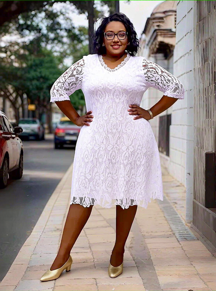 White lace midi dress with short sleeves and floral overlay, flared skirt