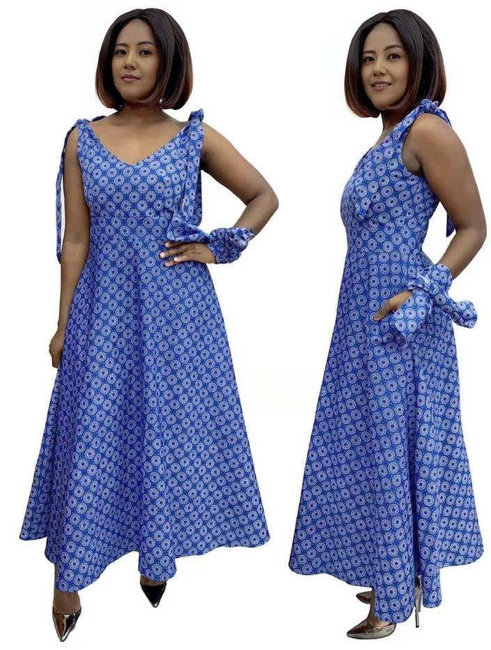 Blue patterned A-line V-neck dress with sleeveless adjustable straps and tied waist