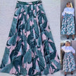 High-waist flowy tropical leaf skirt with teal and pink leaf print, elastic waistband