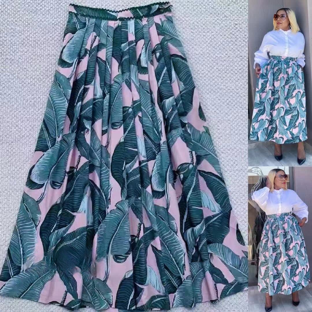 High-waist flowy tropical leaf skirt with teal and pink leaf print, elastic waistband