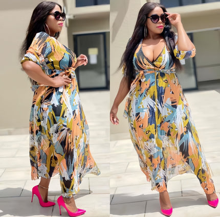 Printed V-neck maxi dress with adjustable tie waist, short sleeves, multicolor abstract pattern.
