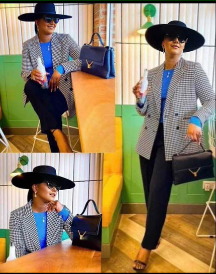 Black-and-white houndstooth double-breasted blazer with notched lapels and buttons
