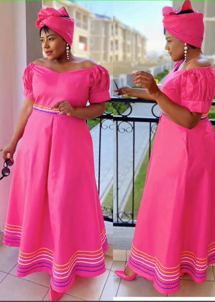 Pink puff-sleeve traditional dress with belt, square neckline, striped hem